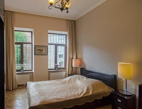 Katil atau katil-katil dalam bilik di TiflisLux Apartment - Chaikovski