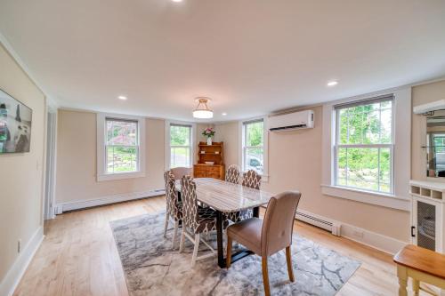a dining room with a table and chairs at 3 Bedroom Cape House by Leavetown Vacations in Sandwich