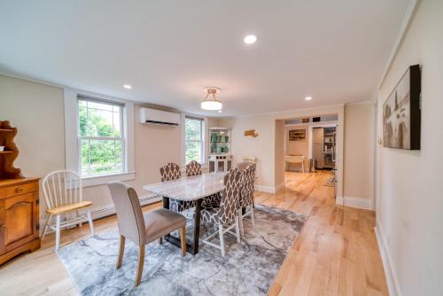 a dining room with a table and chairs at 3 Bedroom Cape House by Leavetown Vacations in Sandwich