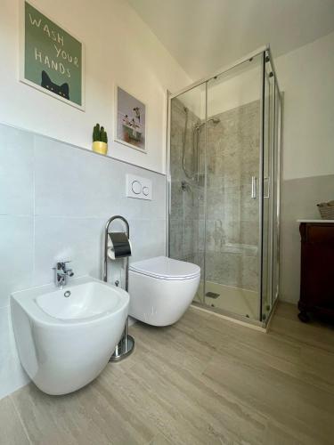 a bathroom with a shower and a sink and a toilet at Casa Pierina in Vicchio