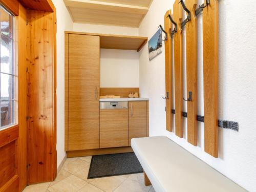 a small bathroom with a bench in a room at Schleicherhof III in Strass im Zillertal