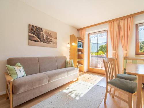 a living room with a couch and a table at Schleicherhof V in Strass im Zillertal