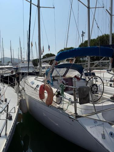 a sailboat docked in a harbor with other boats at Voilier Dufour Classic 35 in Hendaye