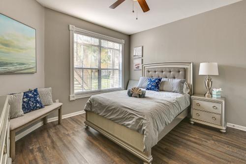 a bedroom with a bed and a window at Saltwater Pool and 4 Mi to Beach Clearwater Condo! in Clearwater
