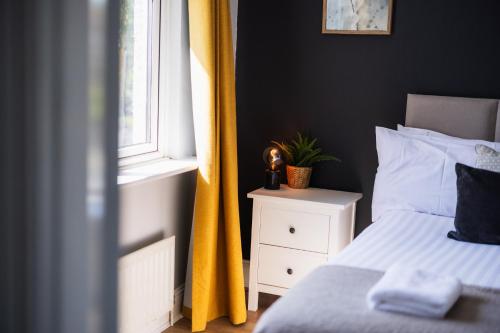 Postel nebo postele na pokoji v ubytování Durham Hideaway