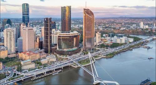 an overhead view of a city with a bridge at Luxury apartment at Queens Wharf Tower in Brisbane