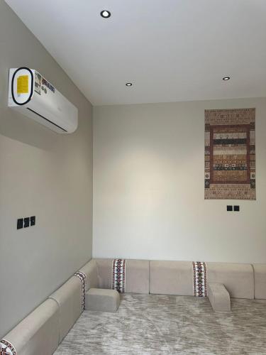 a living room with a couch and a ceiling fan at Luma villa in Khamis Mushayt