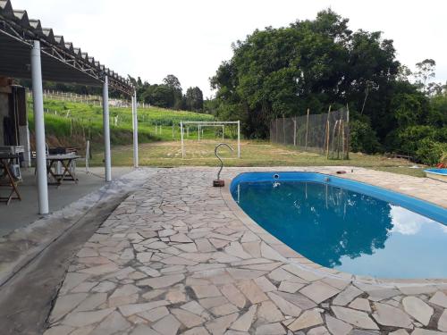 Kolam renang di atau dekat dengan Chalés pesqueiro aconchego
