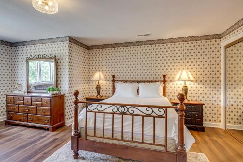 a bedroom with a bed and a dresser and a mirror at Gated 35-Acre De Soto Estate Pool, Lake and Patio! in De Soto
