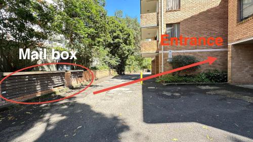 a sign that says mall box in front of a building at Macquarie university and Metro nearby in Sydney