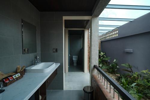 a bathroom with a sink and a toilet at Sea to Sea Villa Boutique in Hue