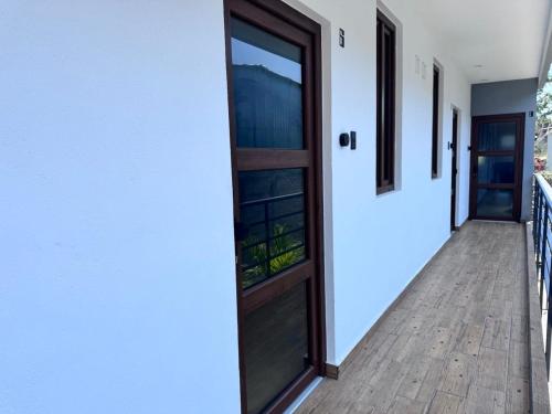 a door to the balcony of a house at Casa ZeRo in Manzanillo