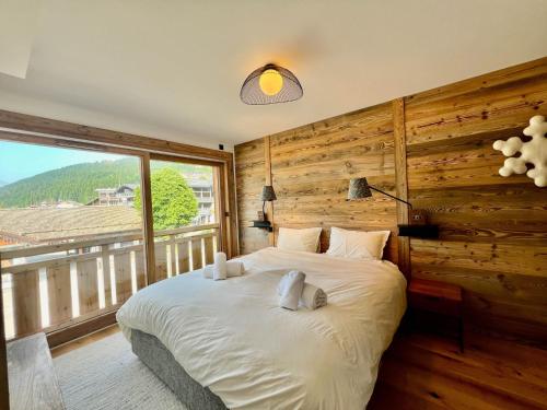 Postel nebo postele na pokoji v ubytování Confort familial aux Gets, 3 chambres, 9 pers, Wi-Fi, parking - FR-1-671-297