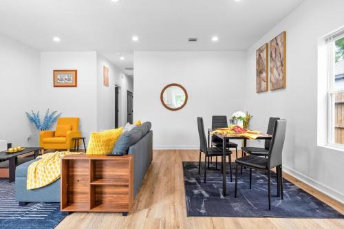 a living room with a couch and a table at Cozy Modern 3BR Houston Townhome in Houston