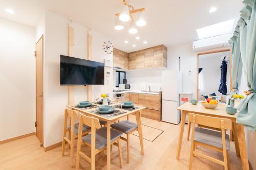 a kitchen and dining room with a table and chairs at 70sqm Private House, Major Tokyo Spots & Free Parking in Tokyo