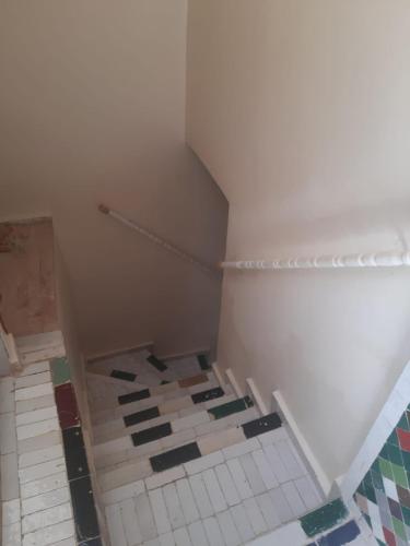 an attic room with a tiled floor at Riad Serendipity in Fès