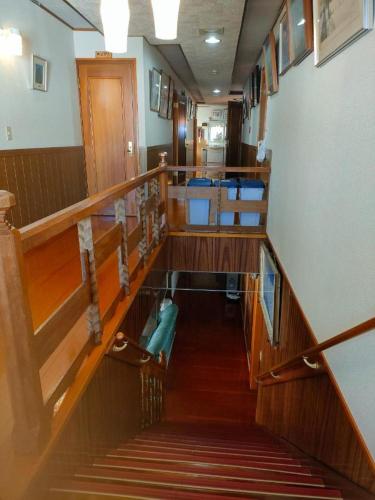 a view of a staircase in a building at たかね荘 in Hakuba