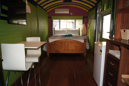 a bedroom with a bed and a desk in a room at South Terrace Studio - Walk to Everything ! in South Fremantle