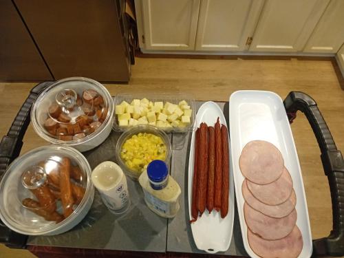 a table topped with lots of different types of food at Bed And Breakfast In Fraser Valley R2 - R3 in Abbotsford