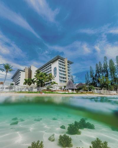 a view of the resort from the water at Chateau Royal Beach Resort & Spa, Noumea in Noumea