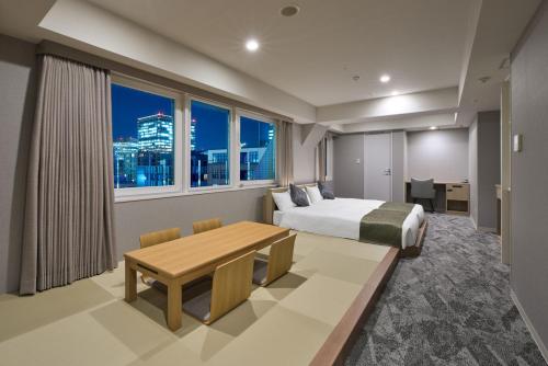 Ένα ή περισσότερα κρεβάτια σε δωμάτιο στο Hotel Villa Fontaine Tokyo-Otemachi