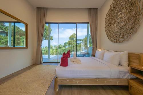 Ένα ή περισσότερα κρεβάτια σε δωμάτιο στο Villa Jazz sea view & Pool