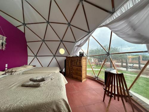 Postel nebo postele na pokoji v ubytování Aldea Hualtepec Glamping