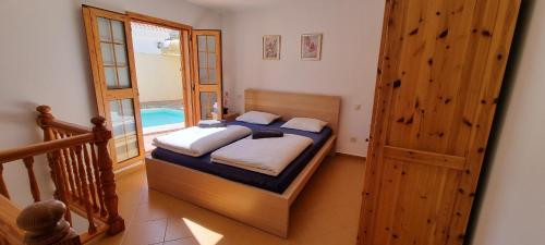 En eller flere senge i et værelse på Private house Tauro 10 - Simunek