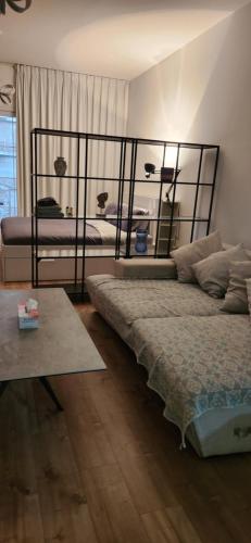 a bedroom with two beds and a table at A chilled place JVC in Dubai