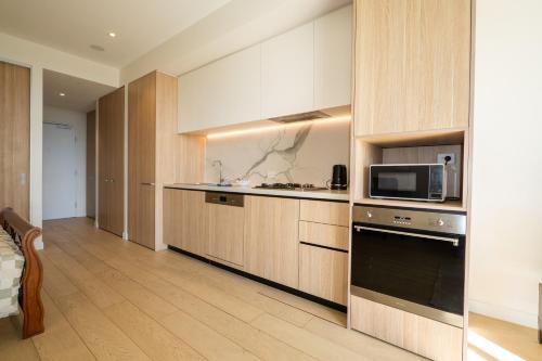 Luxury studio unit in Macquarie Parkにあるキッチンまたは簡易キッチン