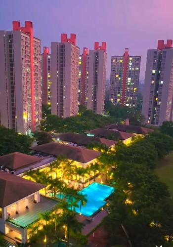 a view of a city at night with buildings at The Manor in Pune