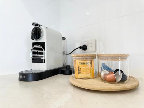 a kitchen counter with a toaster and a blender at Pelican Shore Villa 4 - Kalbarri WA in Kalbarri