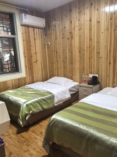 Postel nebo postele na pokoji v ubytování PI Network Inn