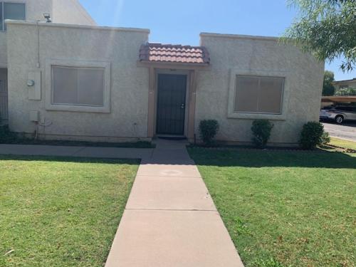 a house with a walkway in front of a house at Convenient place in Phoenix in Phoenix