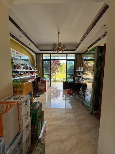 a room filled with boxes and a room with a table at Avatar Valley Villas in Zhangjiajie