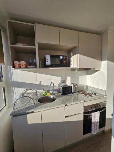 Kuchyň nebo kuchyňský kout v ubytování Acogedor Departamento Estudio