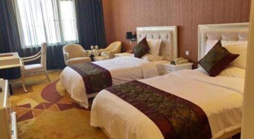 Ένα ή περισσότερα κρεβάτια σε δωμάτιο στο Metropark Hotel