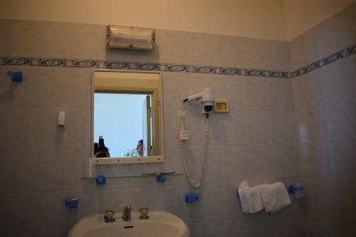 Koupelna v ubytování Hotel Astoria