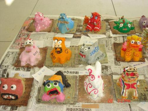a group of stuffed animals sitting on top of a newspaper at Nature Miraikan in Naha