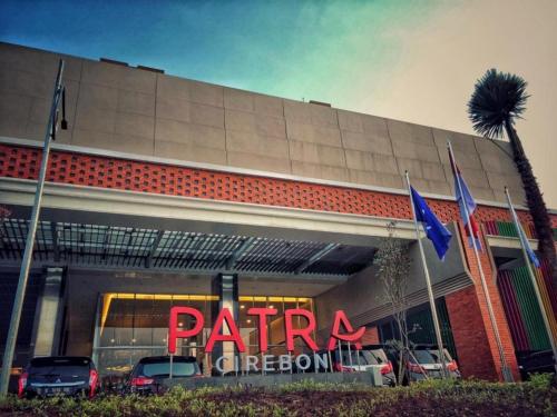 a parking garage with cars parked in front of it at Patra Cirebon Hotel & Convention in Cirebon