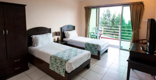 Postel nebo postele na pokoji v ubytování Celyn Resort Kinabalu