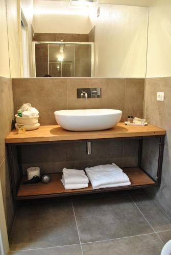 a bathroom with a sink and a mirror at Antica Corte la Valle in Sona