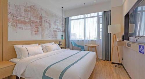 Letto o letti in una camera di City Comfort Inn Taizhou International Exhibition Center