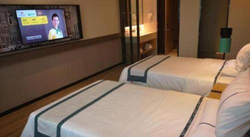 Μια τηλεόραση ή/και κέντρο ψυχαγωγίας στο City Comfort Inn Mianyang Southwest University Of Science And Technology