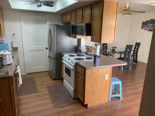a kitchen with a stove and a refrigerator at Convenient place in Phoenix in Phoenix