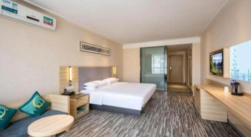 Letto o letti in una camera di City Comfort Inn Zhanjiang South Railway Station