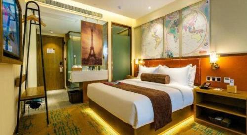 a hotel room with a large bed and a bathroom at James Joyce Coffetel· Xianyang Renmin Road Central Square Store in Xianyang