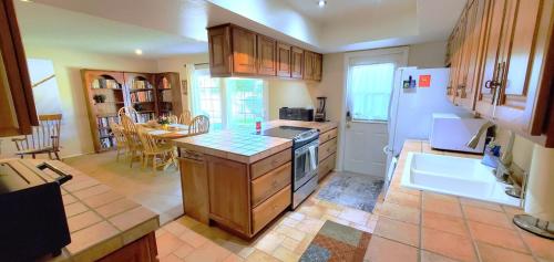 a kitchen with a sink and a stove top oven at House & Private Pool, Fast Wifi, Great Location! in Scottsdale