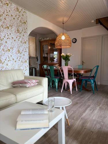 a living room with a couch and a table at Maison avec Piscine - Vue exceptionnelle - Parisot in Parisot-Tarn-et-Garonne