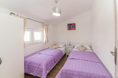 Ένα ή περισσότερα κρεβάτια σε δωμάτιο στο Apartments Kampanel